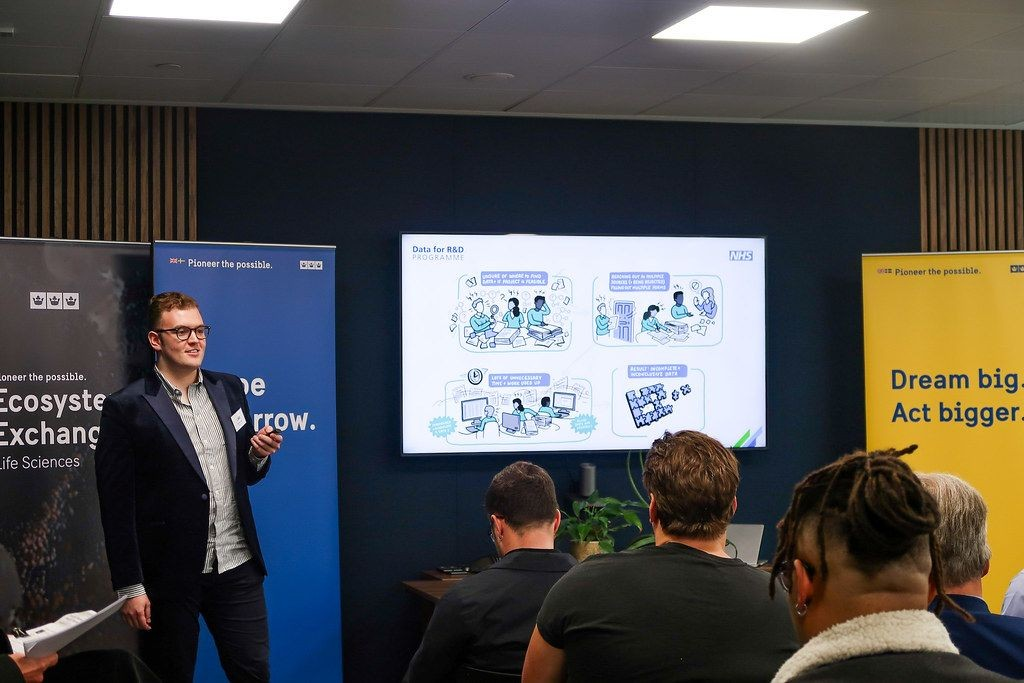 Jake Marshall presenting the NHS Data for R&D programme at a life sciences Ecosystem Exchange event